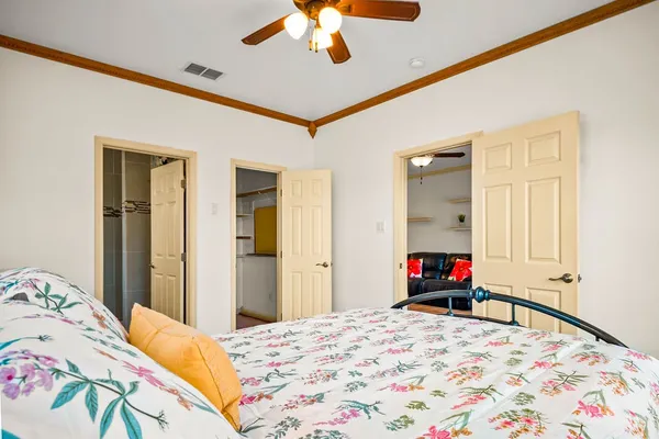a bedroom with a bed and a dresser
