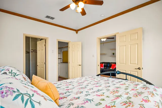 a bedroom with a bed and a dresser