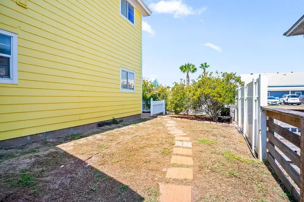 a view of a backyard of the house
