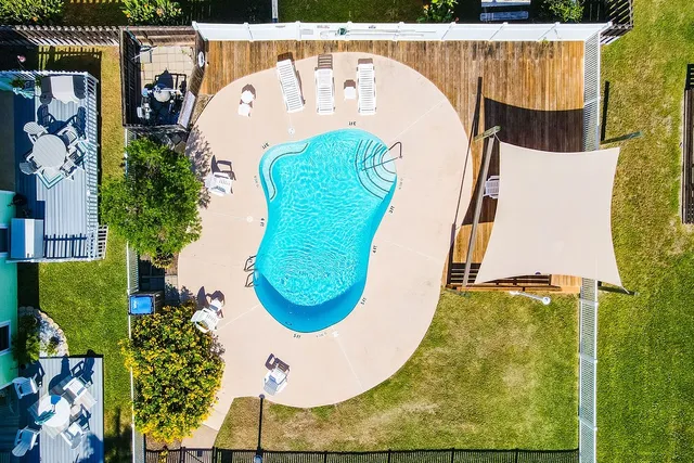 an aerial view of a swimming pool