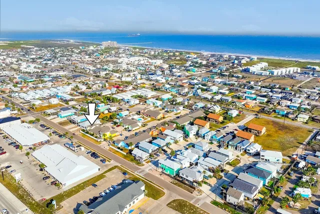 an aerial view of residential building and ocean