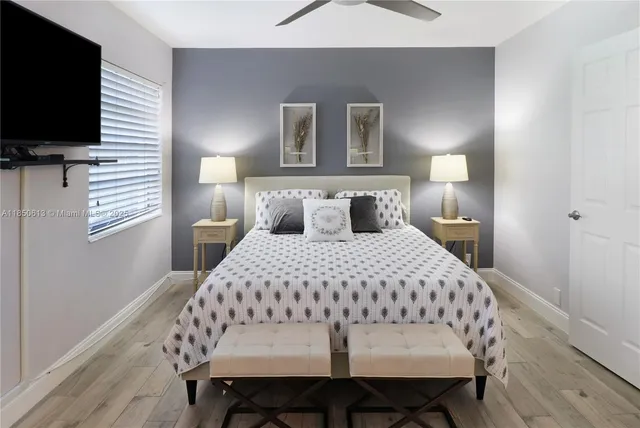 a bathroom with a granite countertop sink a toilet and a bathtub