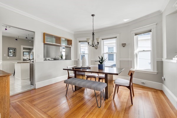 37 Bromfield Road Somerville, MA 02144 - Photo 13 of 39 a view of a dining room with furniture window and wooden floor