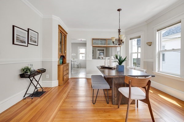 37 Bromfield Road Somerville, MA 02144 - Photo 14 of 39 a view of a dining room with furniture window and wooden floor
