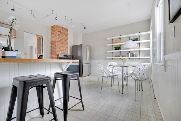 37 Bromfield Road Somerville, MA 02144 - Photo 16 of 39 a dining room with furniture and window
