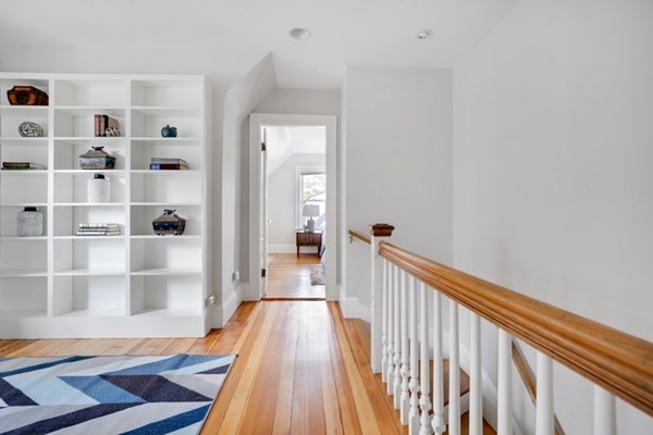 37 Bromfield Road Somerville, MA 02144 - Photo 19 of 39 a view of a hallway with wooden floor and windows