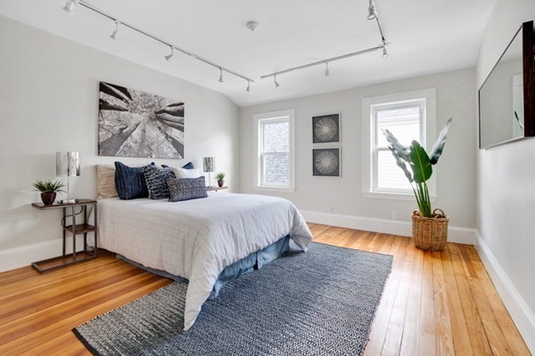 37 Bromfield Road Somerville, MA 02144 - Photo 20 of 39 a bedroom with bed and wooden floor