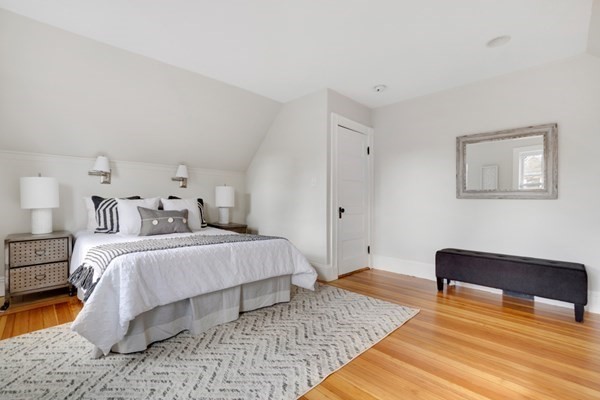 37 Bromfield Road Somerville, MA 02144 - Photo 21 of 39 a spacious bedroom with a bed and a couch