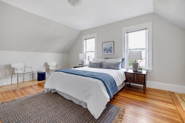 37 Bromfield Road Somerville, MA 02144 - Photo 22 of 39 a bedroom with a bed and a table