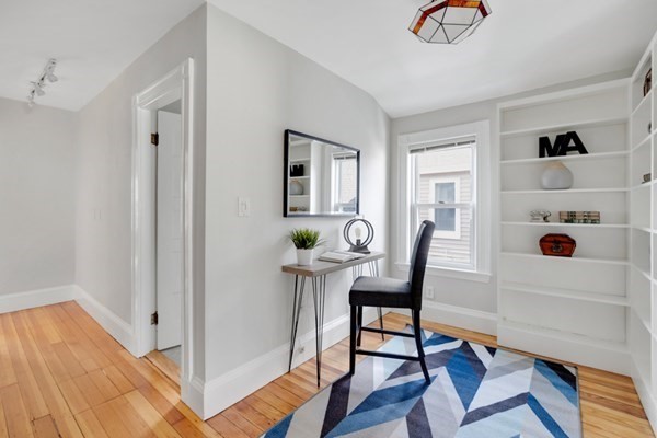 37 Bromfield Road Somerville, MA 02144 - Photo 23 of 39 a view of a workspace with furniture and wooden floor