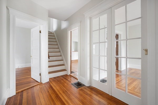 37 Bromfield Road Somerville, MA 02144 - Photo 25 of 39 a view of front door with hallway and wooden floor