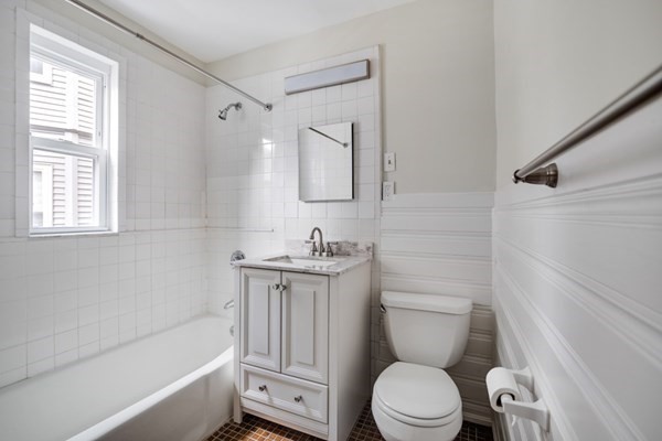 37 Bromfield Road Somerville, MA 02144 - Photo 27 of 39 a bathroom with a sink a toilet and a bathtub
