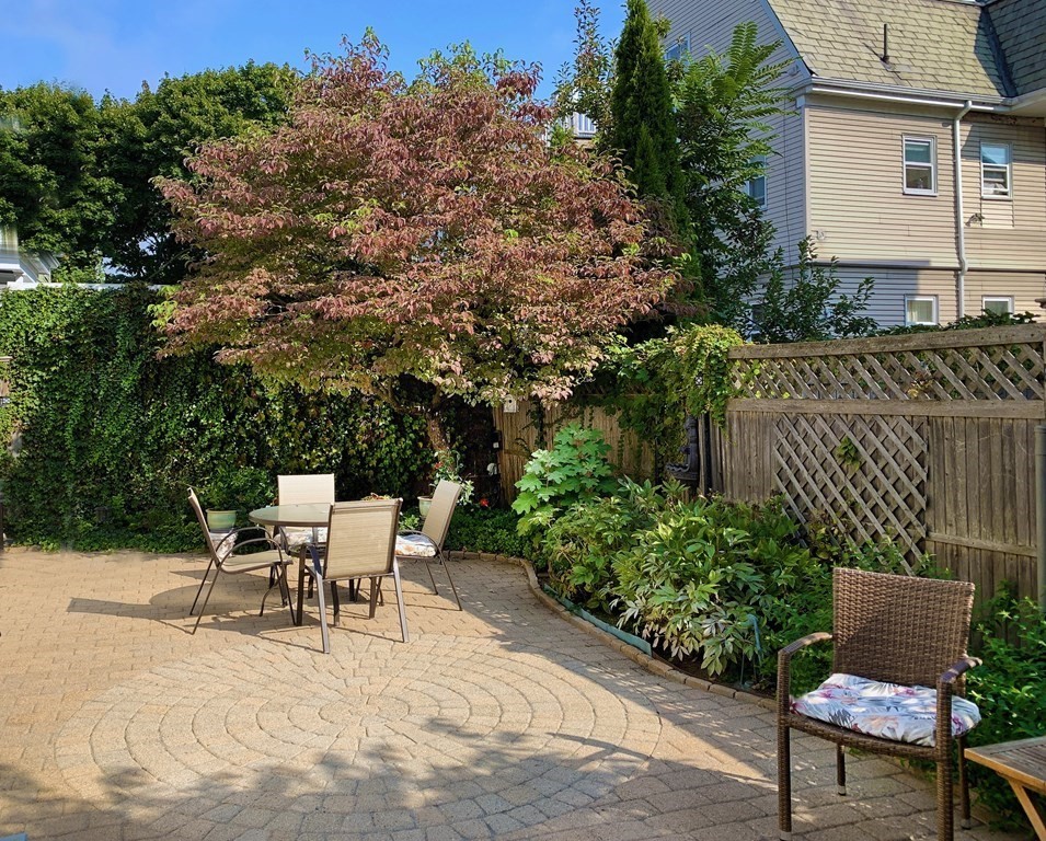 37 Bromfield Road Somerville, MA 02144 - Photo 35 of 39 a view of a patio with table and chairs and potted plants