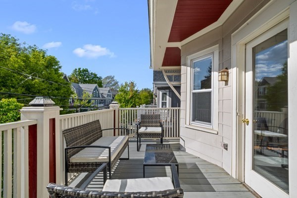 37 Bromfield Road Somerville, MA 02144 - Photo 6 of 39 a view of a patio with table and chairs and potted plants