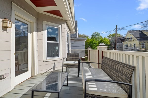 37 Bromfield Road Somerville, MA 02144 - Photo 7 of 39 a patio with table and chairs
