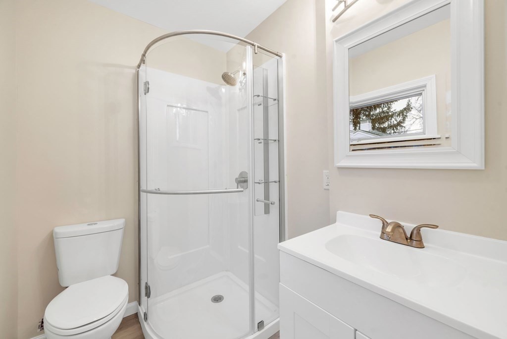 77 Daviston Street Springfield, MA 01108 - Photo 8 of 41 a white toilet sitting next to a bathroom sink