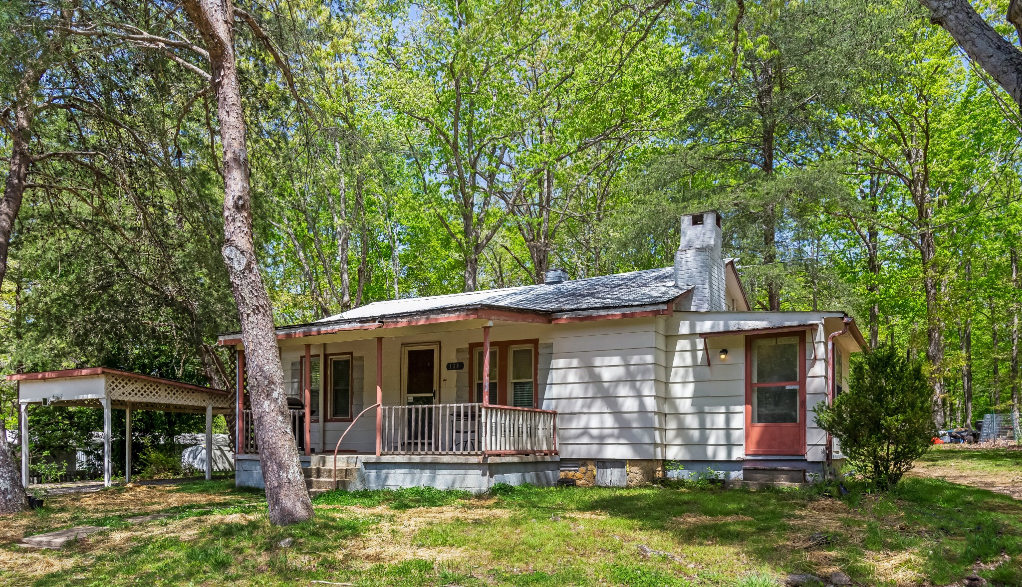 a front view of house with yard and green space