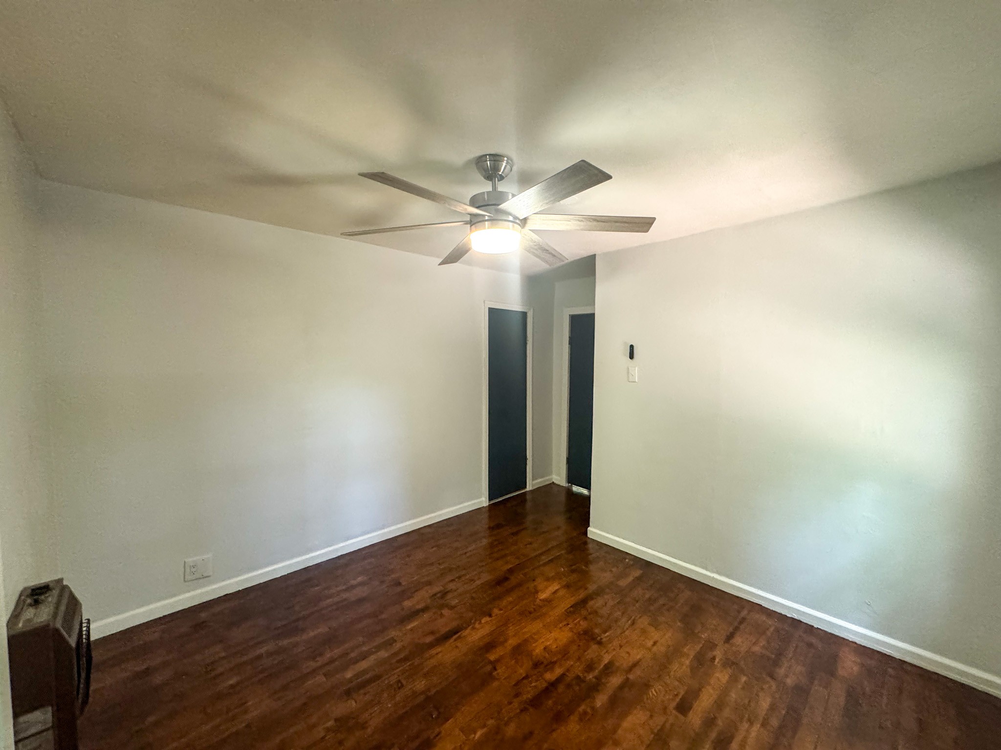 130 McFarlin Road White Bluff, TN 37130 - Photo 19 of 33 an empty room with wooden floor and fan