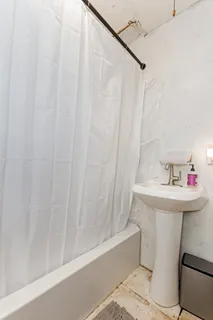 a bathroom with a sink a mirror and a shower