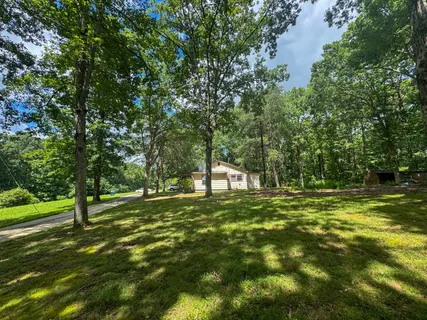 a view of a golf course with a house