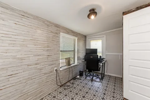 a workspace with furniture and a window