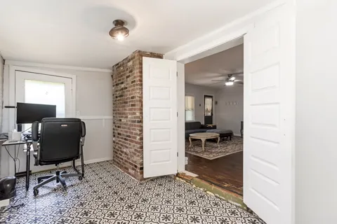 a kitchen with stainless steel appliances a sink cabinets and wooden floor