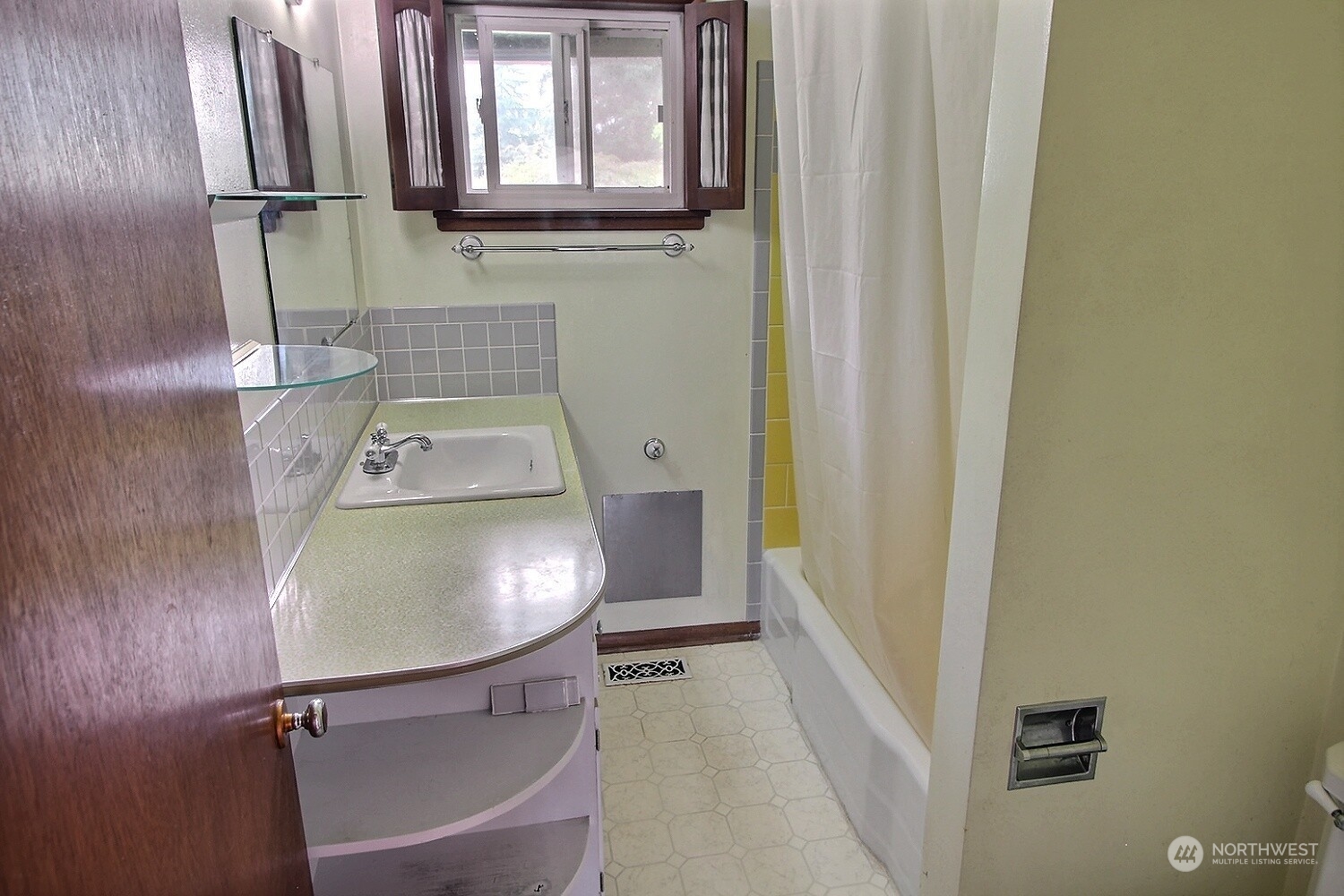 3619 Talbot Road South Renton, WA 98055 - Photo 18 of 27 a bathroom with a sink toilet and tub