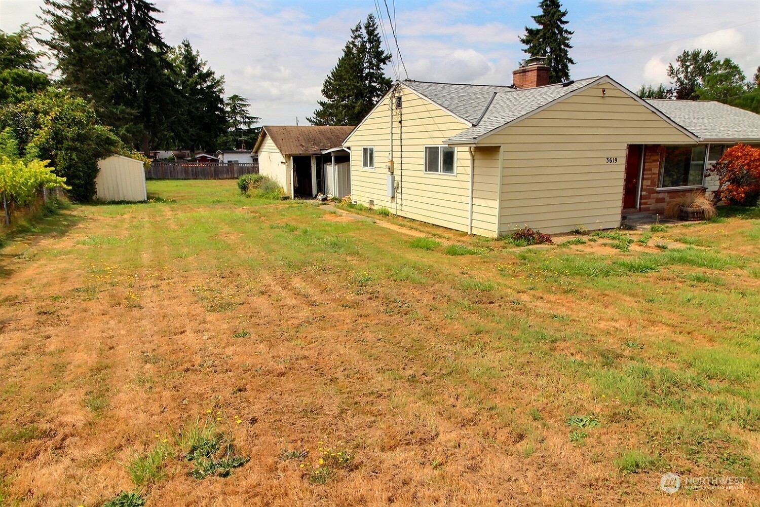 3619 Talbot Road South Renton, WA 98055 - Photo 20 of 27 a front view of a house with yard and garage