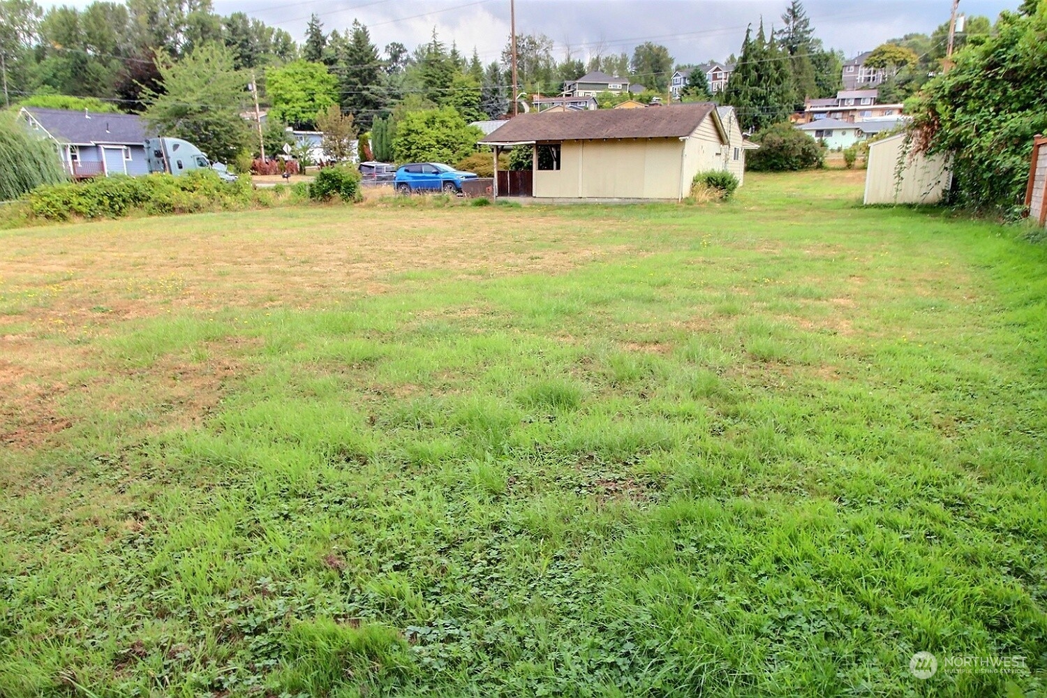 3619 Talbot Road South Renton, WA 98055 - Photo 3 of 27 a view of a house with a yard and sitting area