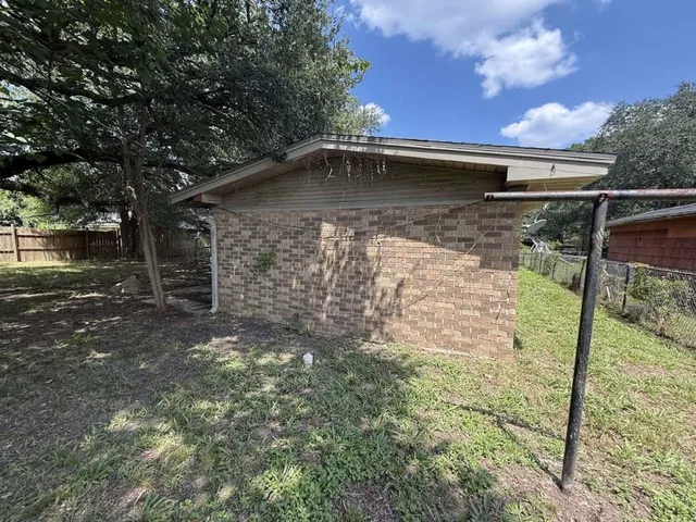 a backyard of a house with lots of green space