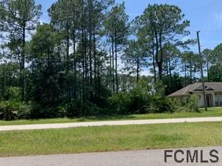 a view of backyard with green space