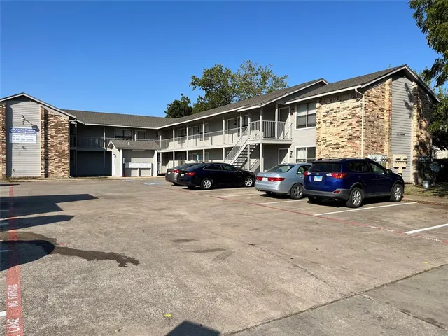 a view of a car parked in front of a building