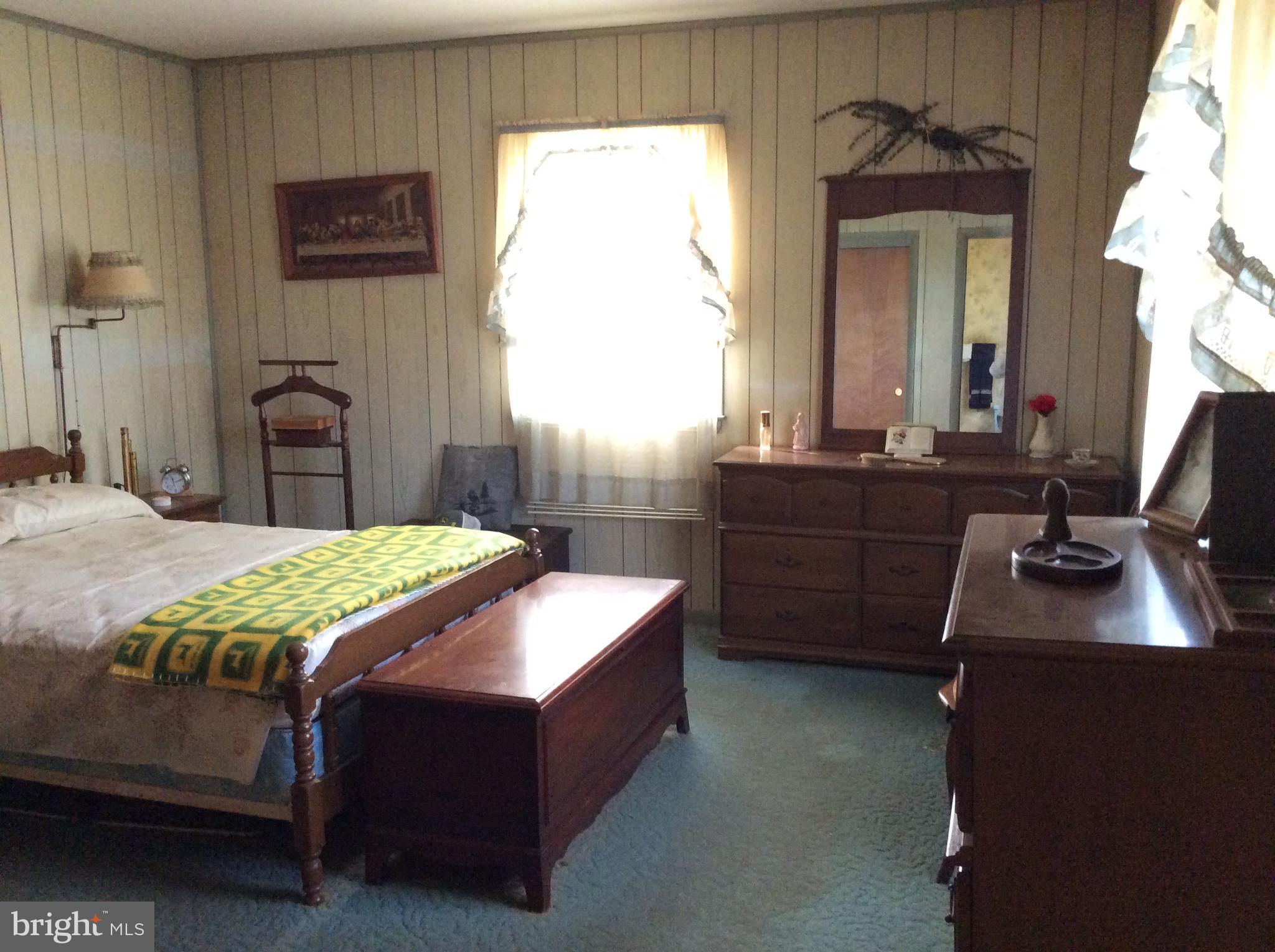 2001 Stulltown Road Millington, MD 21651 - Photo 14 of 18 a bedroom with a bed dresser and a flat tv screen