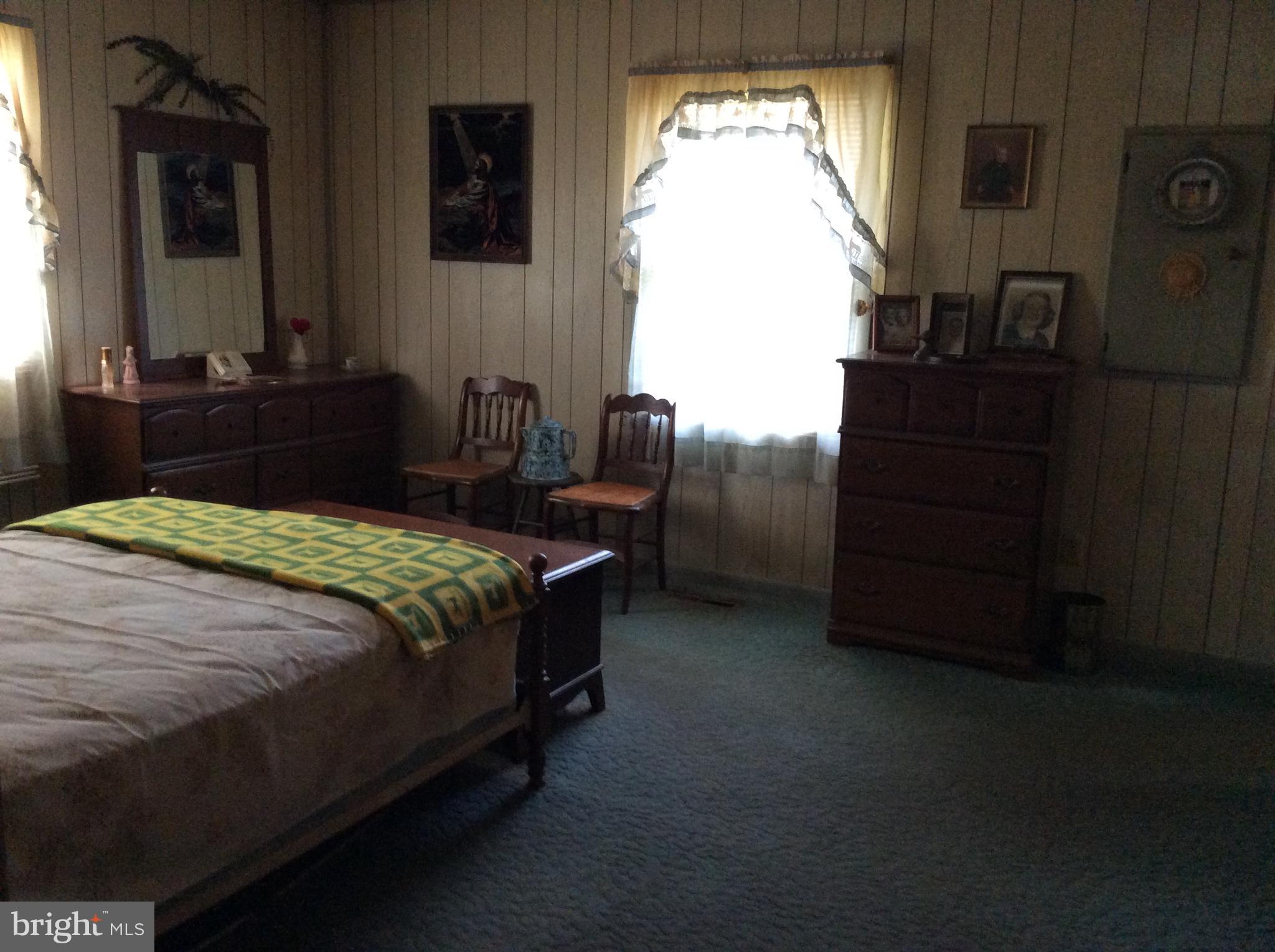 2001 Stulltown Road Millington, MD 21651 - Photo 15 of 18 a bedroom with a bed and a dresser