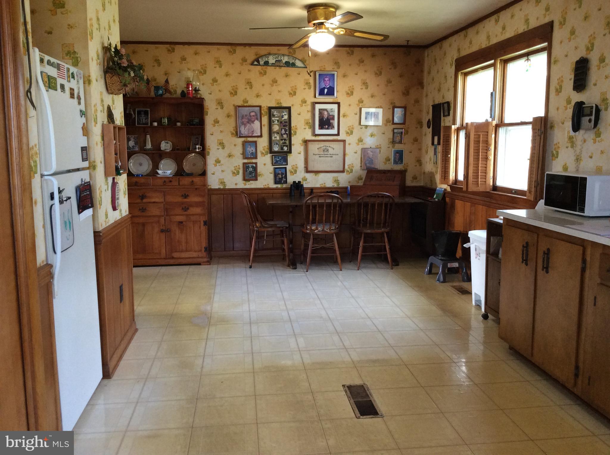 2001 Stulltown Road Millington, MD 21651 - Photo 10 of 18 a room with lots of wooden furniture and windows