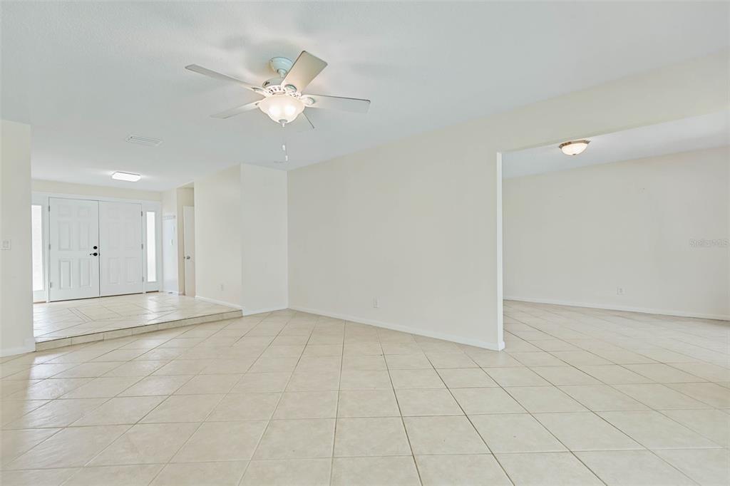 9 Crompton Place Palm Coast, FL 32137 - Photo 11 of 52 an empty room with white walls and ceiling fan
