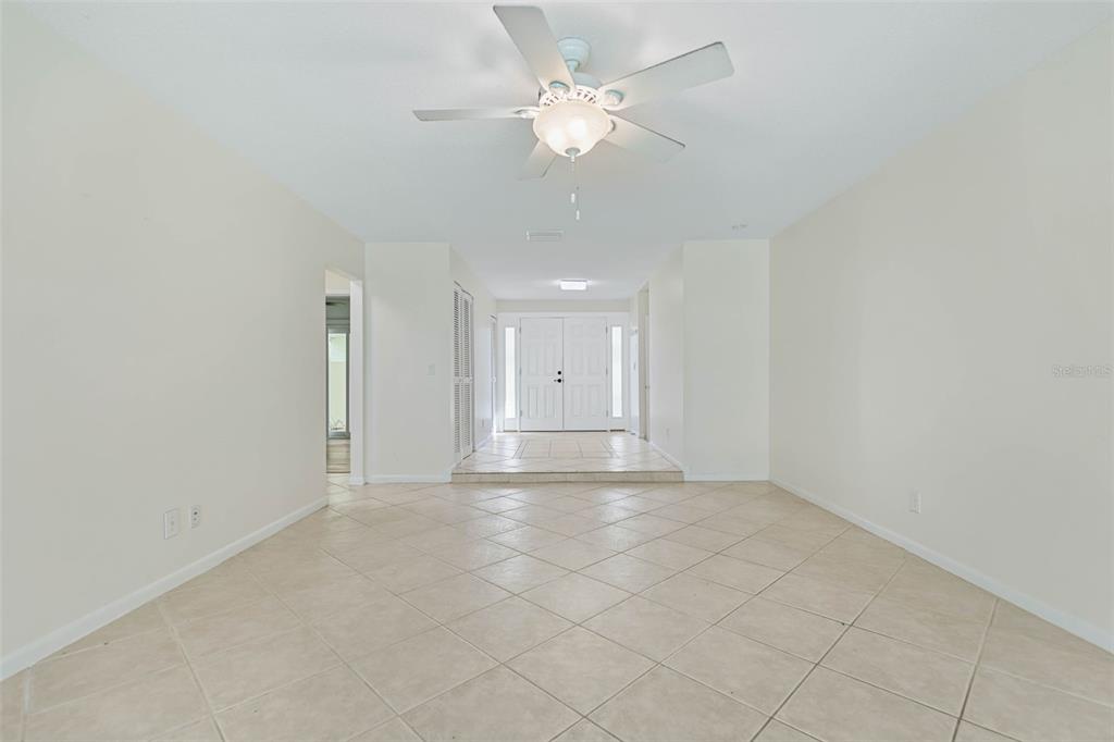 9 Crompton Place Palm Coast, FL 32137 - Photo 14 of 52 an empty room with a ceiling fan and window