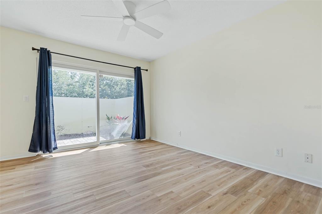 9 Crompton Place Palm Coast, FL 32137 - Photo 15 of 52 an empty room with wooden floor and windows
