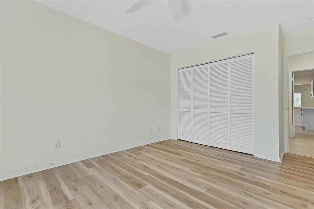 9 Crompton Place Palm Coast, FL 32137 - Photo 16 of 52 a view of empty room with wooden floor