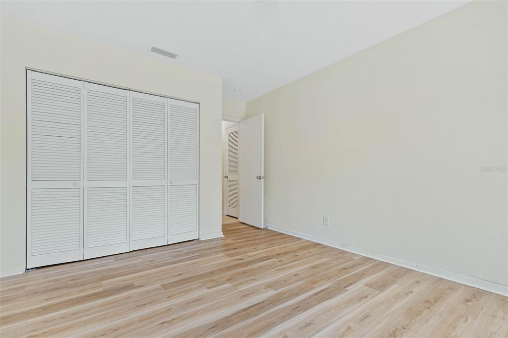 9 Crompton Place Palm Coast, FL 32137 - Photo 17 of 52 an empty room with wooden floor