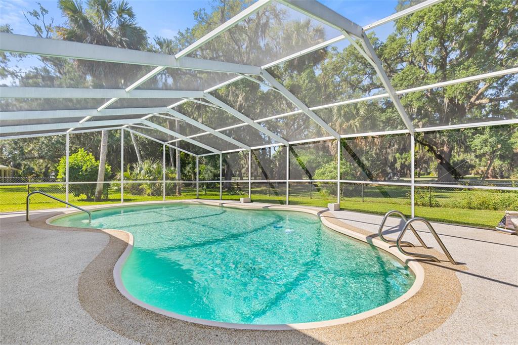 9 Crompton Place Palm Coast, FL 32137 - Photo 2 of 52 a view of a swimming pool with a yard and swimming pool
