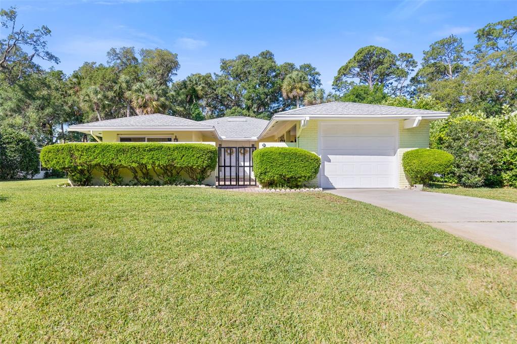 9 Crompton Place Palm Coast, FL 32137 - Photo 31 of 52 a view of a house with a yard