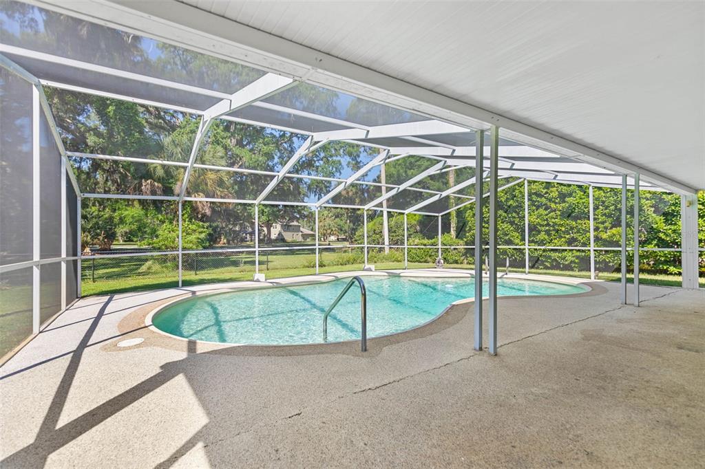 9 Crompton Place Palm Coast, FL 32137 - Photo 36 of 52 a view of a backyard with swimming pool