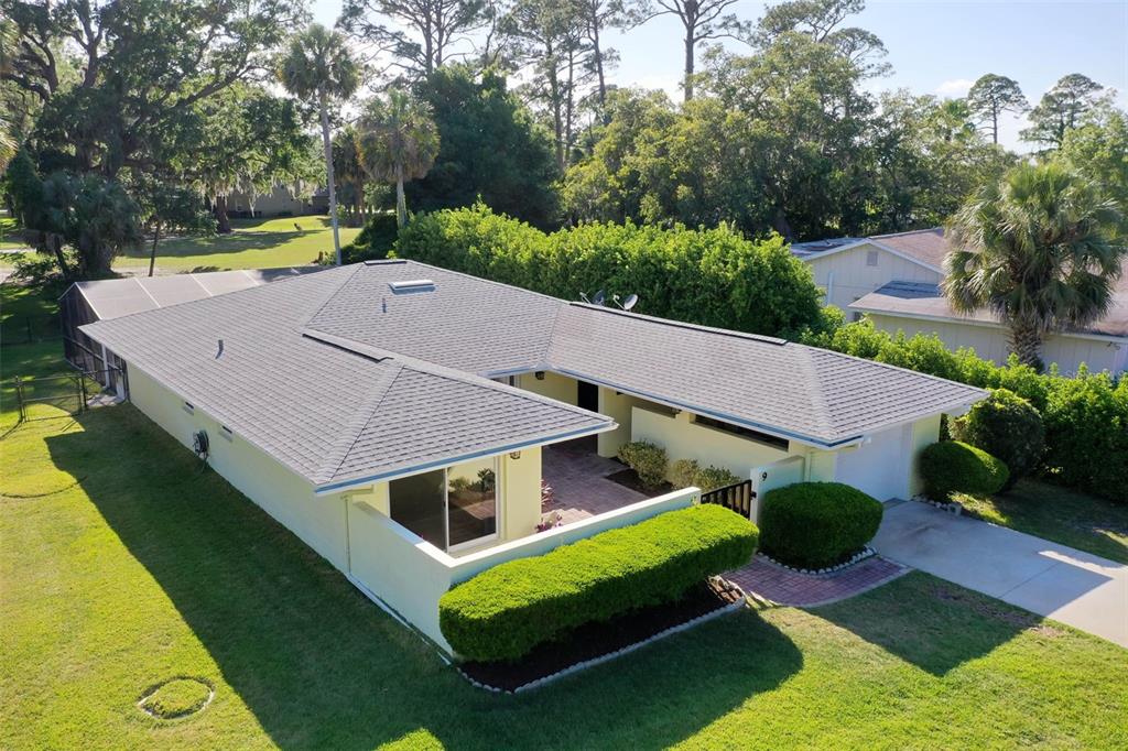 9 Crompton Place Palm Coast, FL 32137 - Photo 44 of 52 an aerial view of a house with swimming pool garden view and trees