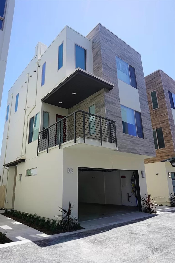 83 Ebb Tide Circle Newport Beach, CA 92663 - Photo 1 of 17 a front view of a house with a yard