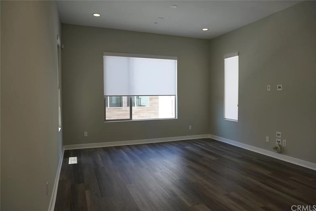 83 Ebb Tide Circle Newport Beach, CA 92663 - Photo 12 of 17 a view of an empty room with wooden floor and a window