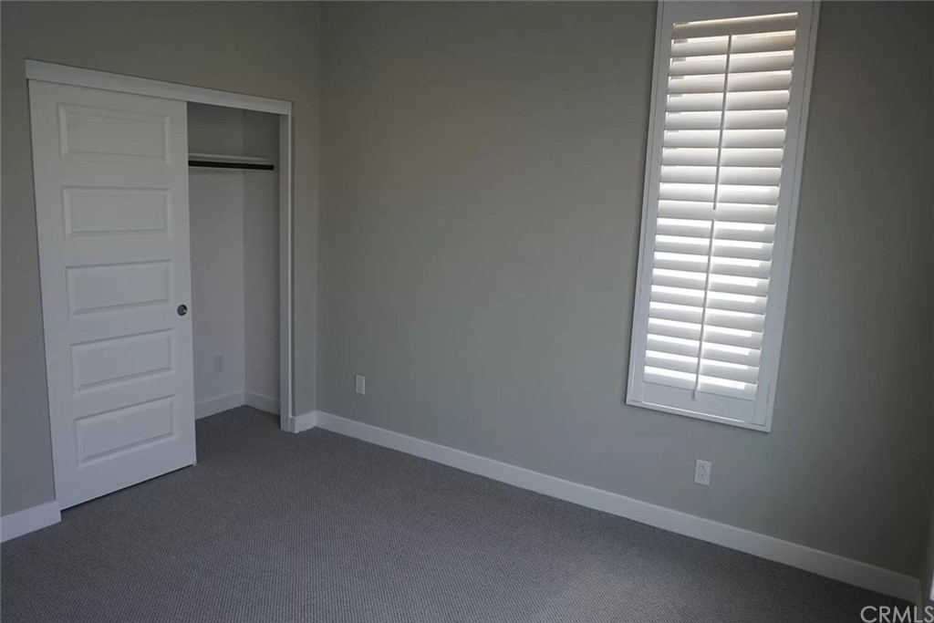 83 Ebb Tide Circle Newport Beach, CA 92663 - Photo 14 of 17 an empty room with windows and closet