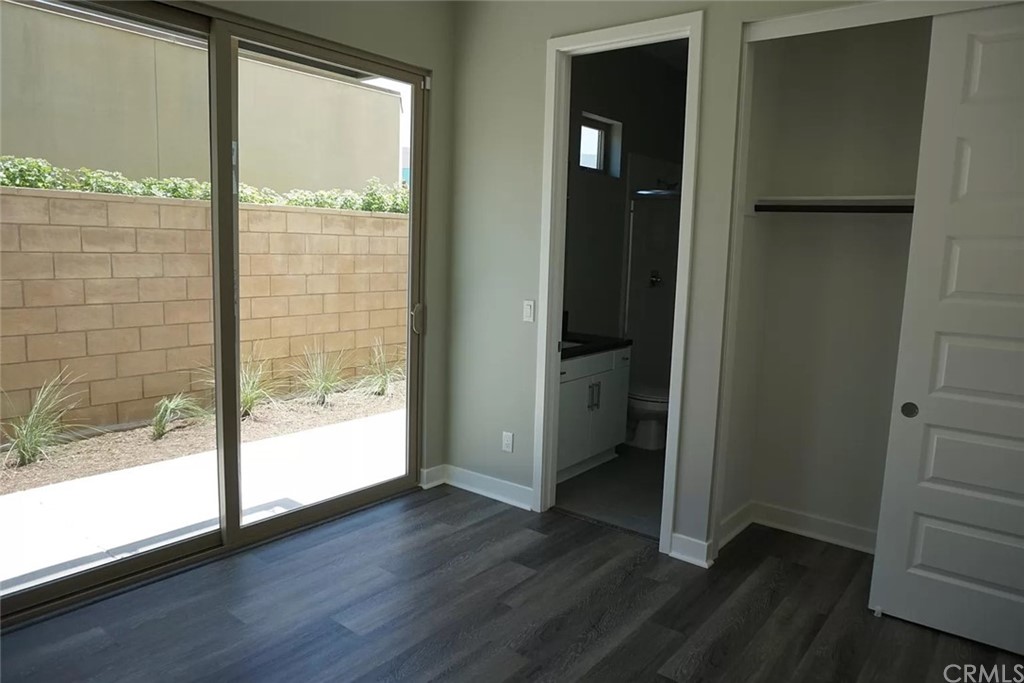 83 Ebb Tide Circle Newport Beach, CA 92663 - Photo 8 of 17 an empty room with wooden floor and windows