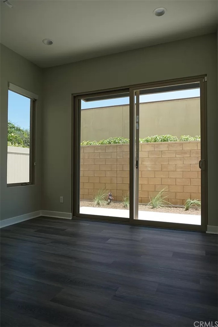 83 Ebb Tide Circle Newport Beach, CA 92663 - Photo 9 of 17 a view of wooden floor and brick walls