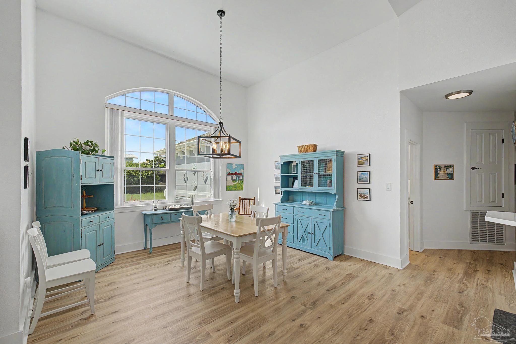 2005 Riviera Lane South Navarre, FL 32566 - Photo 6 of 70 a view of a dining room with furniture window and wooden floor
